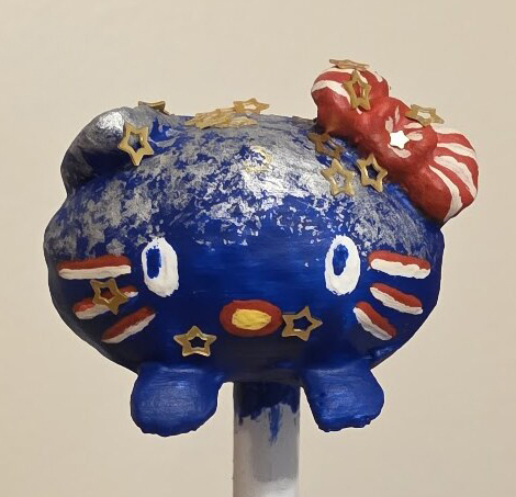 The Loaf Kitty mini painted red, white and blue with gold stars, front view