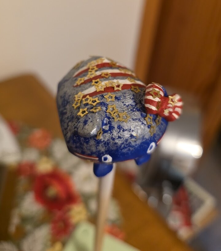 The red, white, and blue painted mini seen from an angle
