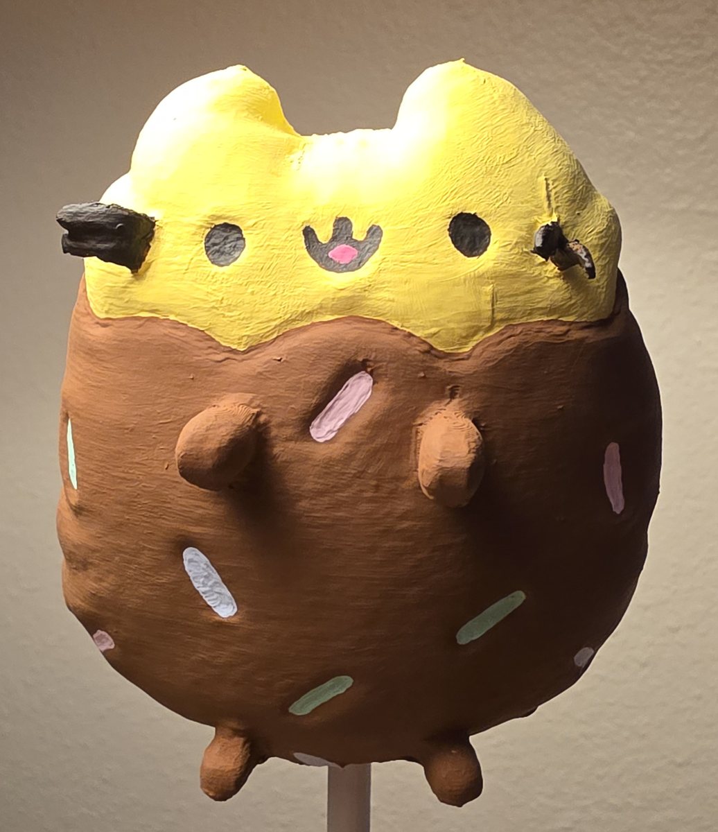 The finished OSHA Beedee mini, painted brown with colorful sprinkles, front view