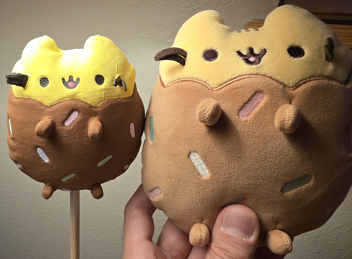 The OSHA Beedee stuffed animal beside its finished 3D-printed, hand-painted mini